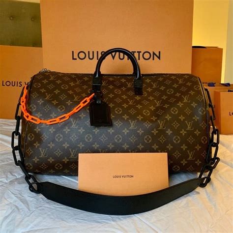 louis vuitton small duffle bag with orange chain